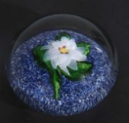19th century St Louis miniature paperweight with a white flower and green leaves on a blue and white