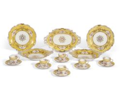 An early 20th century Coalport coffee and part dinner service the yellow ground with richly tooled