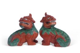 Pair of Oriental Shi-Shi lions with a brown and green design. Provenance: Christies label for 17th