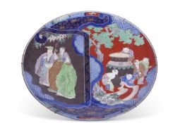 Large Japanese porcelain charger, polychrome decoration of figures and children by a vase, 56cm