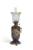 Doulton oil Lamp decorated with panels of birds by Florence Barlow within blue geometric boarders