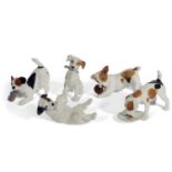 Royal Doulton models of puppies in various poses including; with bone HN1159, with ball HN1103,
