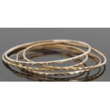 Four yellow metal unmarked bangles, 25.2gms