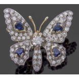 Diamond and sapphire butterfly brooch, the outstretched wings and body decorated with four pear