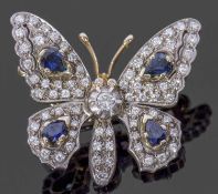 Diamond and sapphire butterfly brooch, the outstretched wings and body decorated with four pear