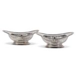 Pair of late Victorian oval bonbon dishes with slot pierced, foliate decoration, pierced oval bases,