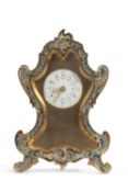 20th century French mantel clock, the shaped metal case with enamel decoration to a small circular