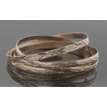 Three hallmarked 9ct gold bangles and one stamped 9kt, 26.3gms