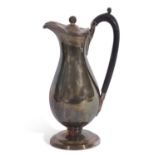 George III hotwater jug of typical baluster form, the hinged lid with ball finial, banded bright-cut