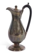 George III hotwater jug of typical baluster form, the hinged lid with ball finial, banded bright-cut