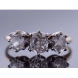 Three stone diamond ring featuring three graduated old cut diamonds, 0.90ct approx, size K