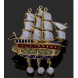 Clipper sailing ship brooch decorated with white, red, and green and blue enamels, with three