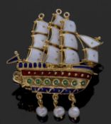 Clipper sailing ship brooch decorated with white, red, and green and blue enamels, with three