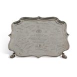 Elizabeth II waiter of shaped square form with 'Chippendale' edge supported on four pad feet