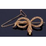 Vintage serpent brooch, the head features two red ruby eyes and three small old cut diamonds, the