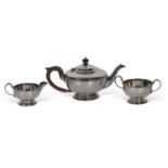 George V three-piece tea set of circular form with beaded rims comprising teapot, two-handled