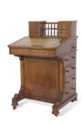 Victorian Walnut veneered davenport desk with small top section, four drawers and galleried centre