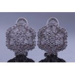 Pair of diamond cluster earrings, the centres with 7 round brilliant cut diamonds raised above a