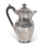 Edwardian hot water jug of circular baluster form with gadrooned rim, ebonised finial to the