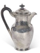 Edwardian hot water jug of circular baluster form with gadrooned rim, ebonised finial to the