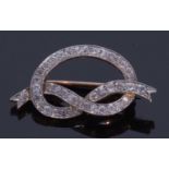 Diamond tied ribbon brooch set with 40 small old brilliant cut diamonds, each individually claw
