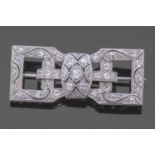 Art Deco precious metal and diamond brooch of rectangular open work shape, set throughout with