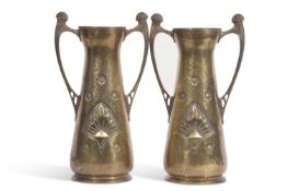 A pair of WMF brass vases in Art Nouveau or Jugendstil style factory mark to base33 cm high