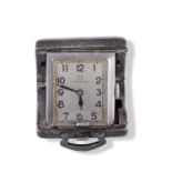 Small silver folding Omega travel clock with hallmark on inside of case, dial stamped 'Omega' and