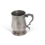 Late George II one pint baluster tankard with leaf capped double 'C' handle, circular foot, 12cm