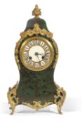 French green boulle and brass inlaid mantel clock of shaped form with applied metal mounts and an