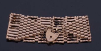 9ct gold wide link gate bracelet with heart padlock and safety chain fitting, 16cm long, 21.2gms