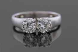 A Two Stone Diamond Ring featuring two round brilliant cut diamonds, individually claw set and
