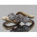 18ct gold three stone diamond ring featuring three round brilliant cut diamonds between plain