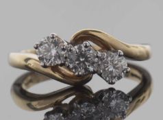 18ct gold three stone diamond ring featuring three round brilliant cut diamonds between plain