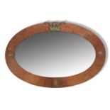 Late 19th century bevelled oval wall mirror in Arts and Crafts style planished copper mounted