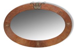Late 19th century bevelled oval wall mirror in Arts and Crafts style planished copper mounted