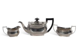 Three-piece tea set of slightly compressed oval form with reeded rims comprising teapot, two handled