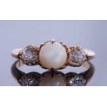 Pearl and diamond three stone ring, the centre pearl between two old brilliant cut diamonds, 0.