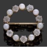 Diamond and seed pearl garland brooch, alternate set with 7 old cut diamonds, approx 1ct, and 7
