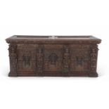 Large 17th-century continental oak coffer with two panelled lid opening to an interior with fitted