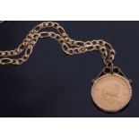 South African Krugerrand dated 1974, framed in a 9ct gold pendant mount suspended from a 9kt.375