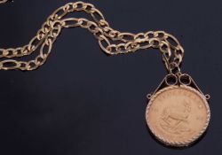South African Krugerrand dated 1974, framed in a 9ct gold pendant mount suspended from a 9kt.375