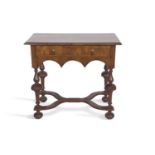 William and Mary style walnut lowboy with a single frieze drawer raised on turned columns and X-
