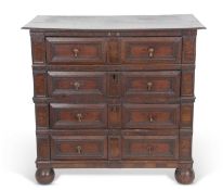 Late 17th/early 18th century oak chest with four long drawers fitted with later drop handles