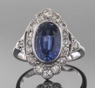 Sapphire and diamond ring, the oval faceted sapphire 10mm x 7mm approx, bezel set within a small