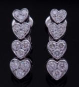 Pair of diamond heart pendant earrings, a style featuring 4 articulated graduated heart diamond