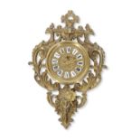 Late 19th/early 20th century French cartel type wall clock, central circular pressed brass and