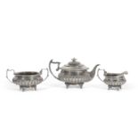 George III Scottish silver tea set of compressed circular form with gadrooned rims, half-fluted