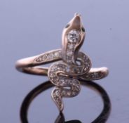Vintage diamond set serpent ring, the coiled body set with graduated old cut diamonds, the head with