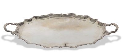 George v heavy tea tray of plain polished oval form having 'Chippendale' rim and two scrolled and